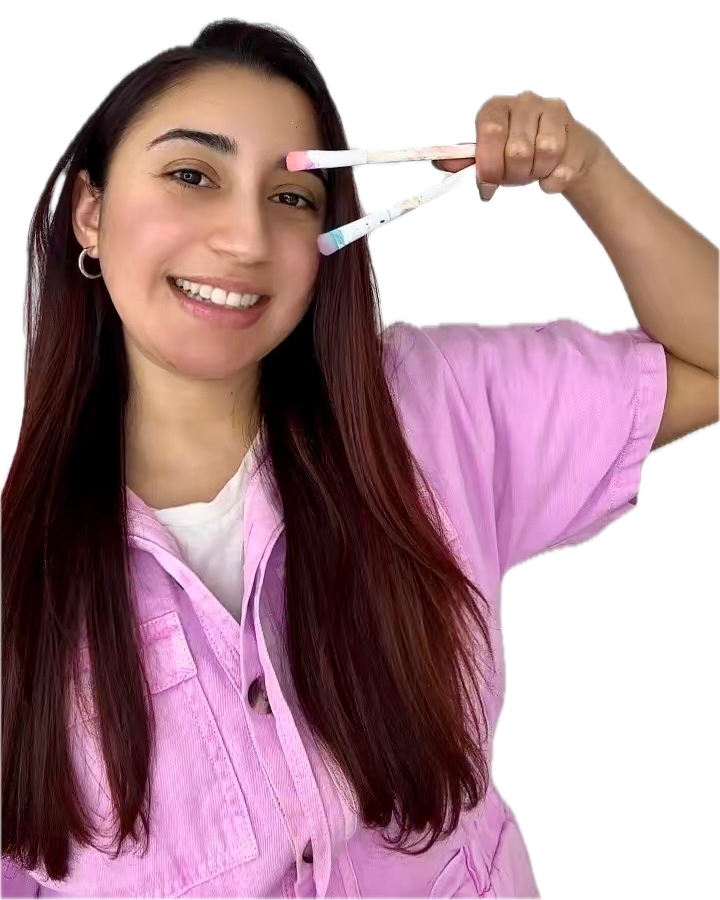 Leticia holding paint brushes