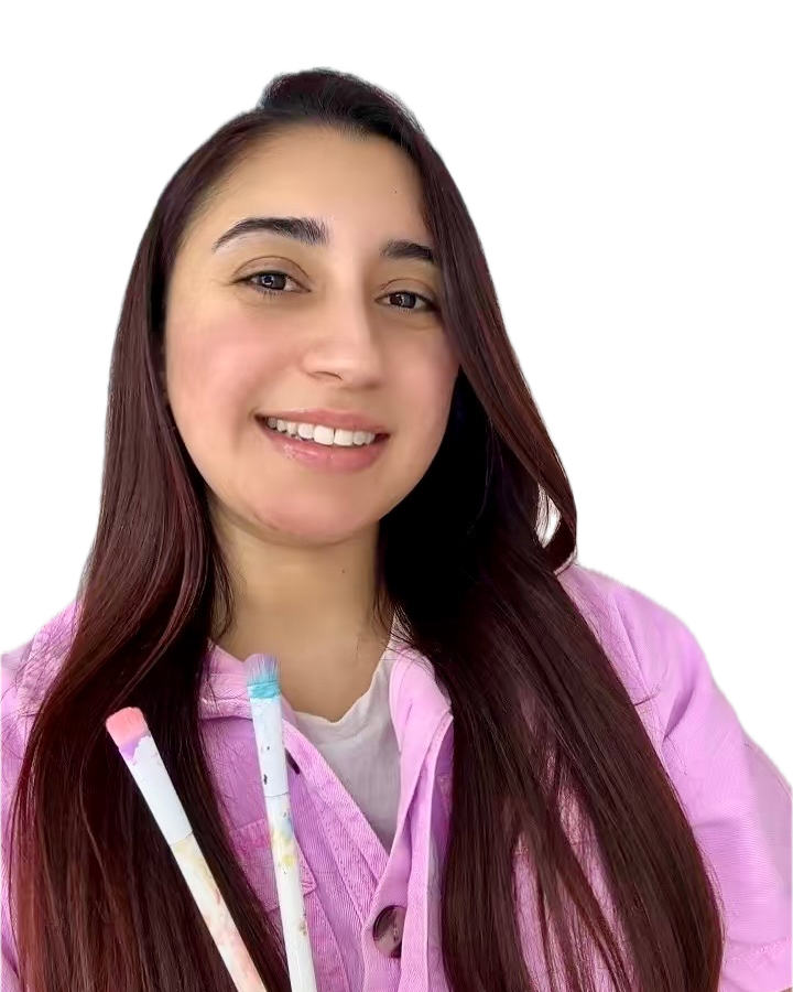 Leticia holding paint brushes